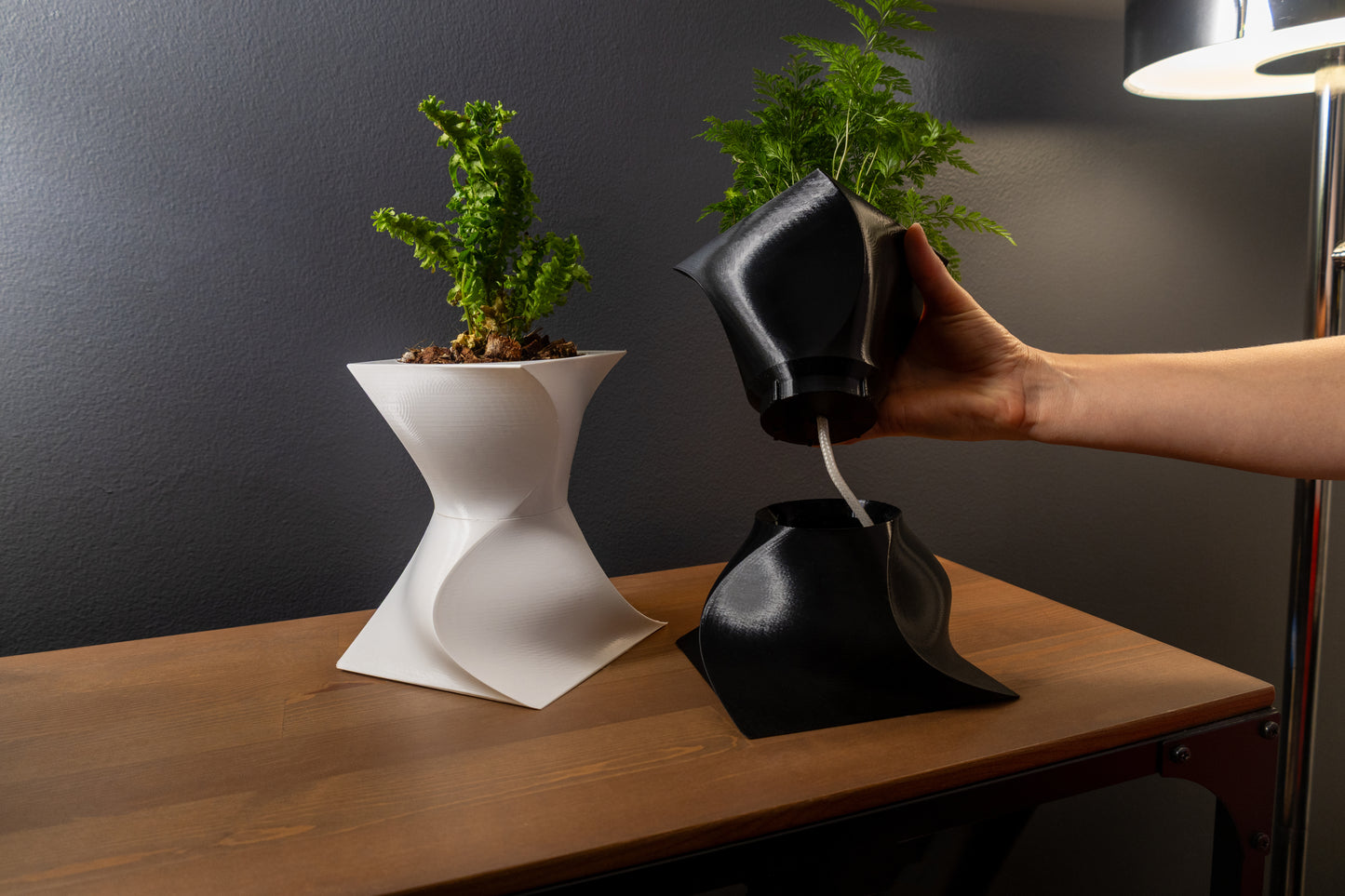 Modern sculptural Vira wicking planter with artistic design for home décor.