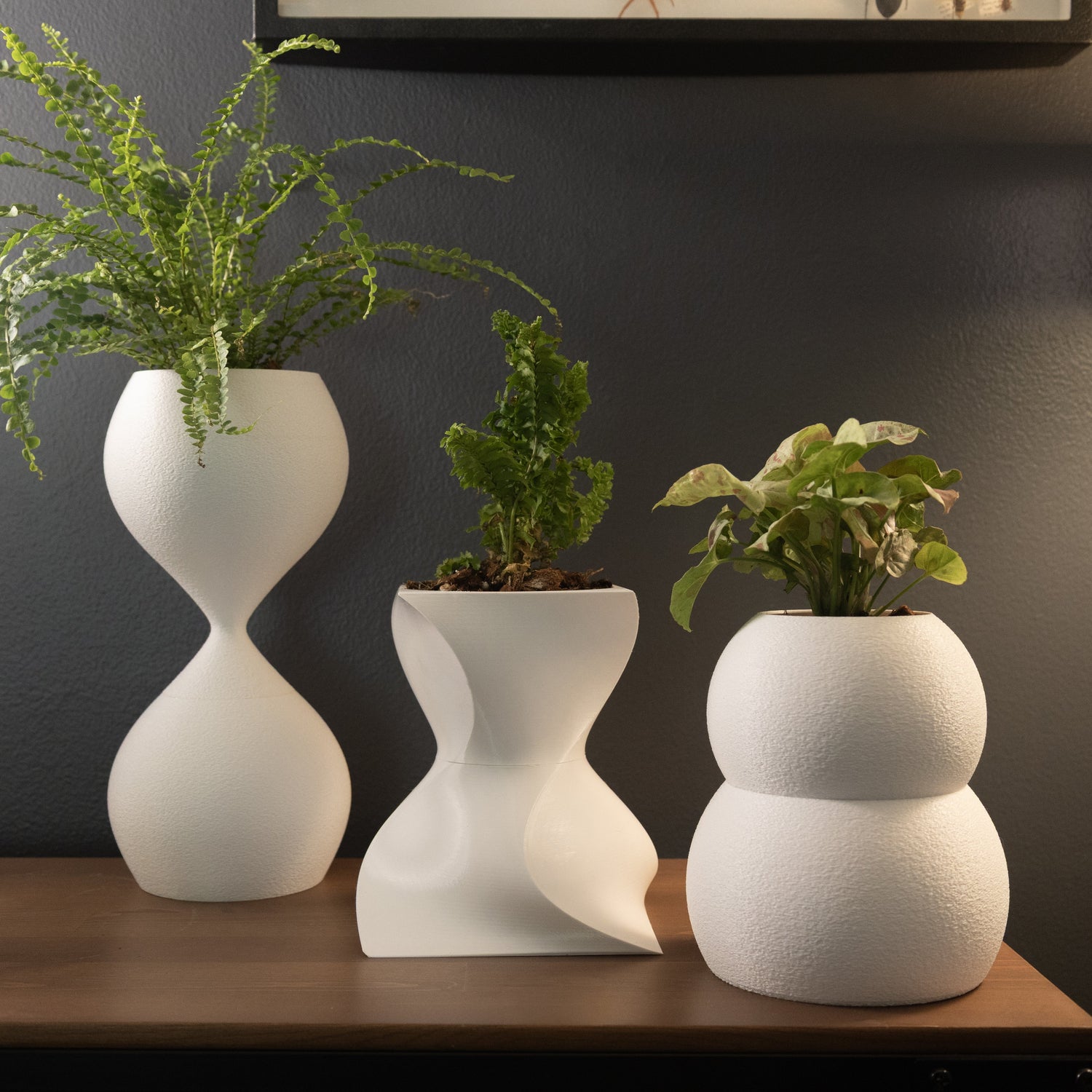 Mossari sculptural wicking pots collection – three modern self-watering planters with built-in reservoirs for houseplants.