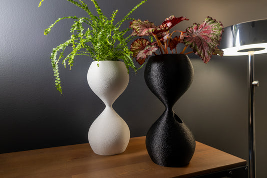 Oasis self-watering wicking pot with modern hourglass design, ideal for healthy indoor houseplants.
