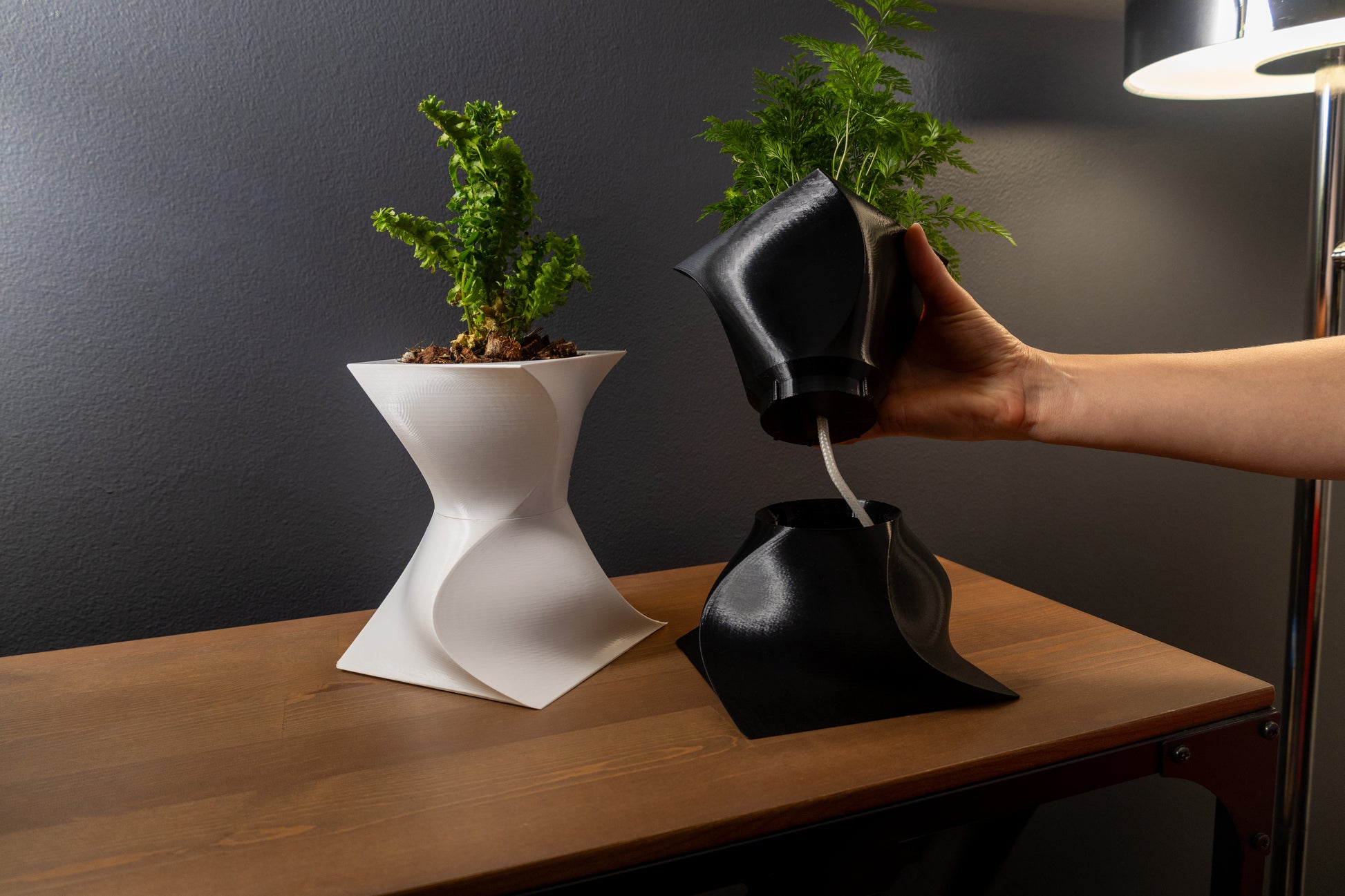 Modern sculptural Vira wicking planter with artistic design for home décor.